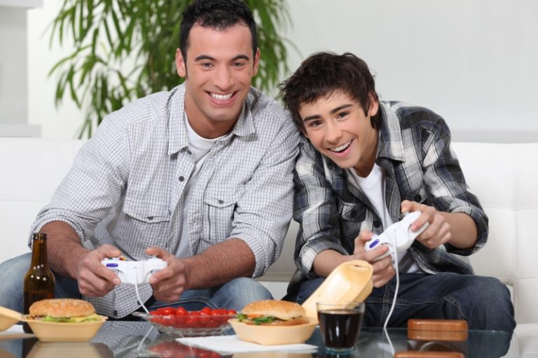 2843470-father-and-son-playing-video-game